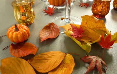 Decorating for Autumn – Table sprinkled with leaves